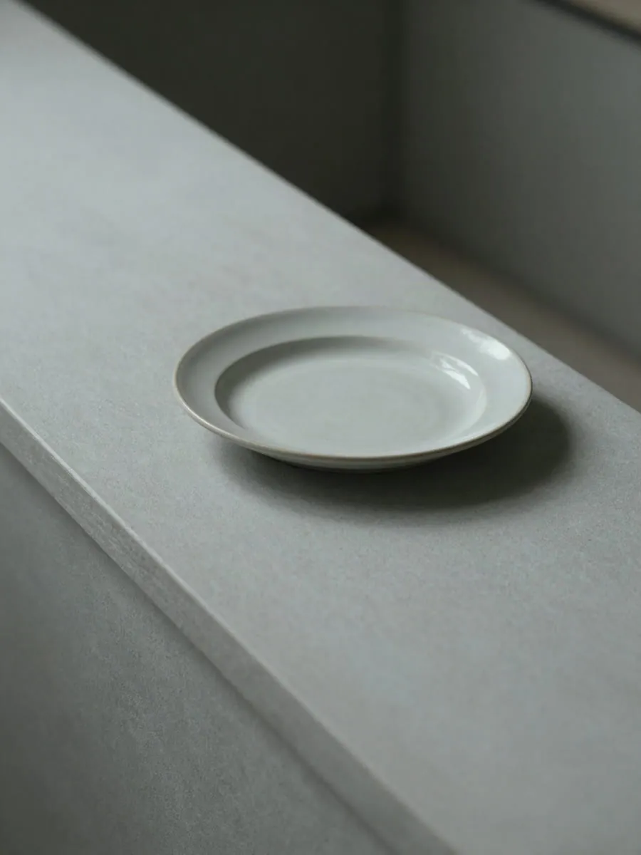 A single piece resting at the end of the counter